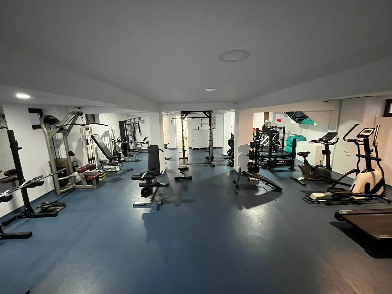 Modern gym equipment in dark setting